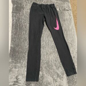 Nike black leggings. Big girl size large. They fit adult size 2/4 as well.